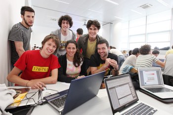 Students smiling in a study room